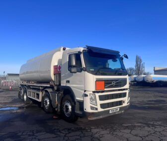 Used 2011 Volvo FM380 8x2 tag-lift fuel tanker with white aluminum barrel, Euro 5 engine, FORS camera system, and Emco Wheaton metering