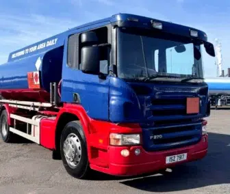 2008 Scania P270 right hand drive fuel tanker truck (lorry) in blue and red, available for export from the UK. Ideal for fuel transport and distribution in Africa, Asia, and South America.