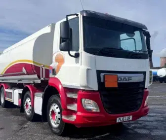 2016 DAF CF410 8x2 fuel tanker truck PL16 LUR with 25,000 litre white and red livery, parked at Clugston International yard, available for worldwide export and shipping
