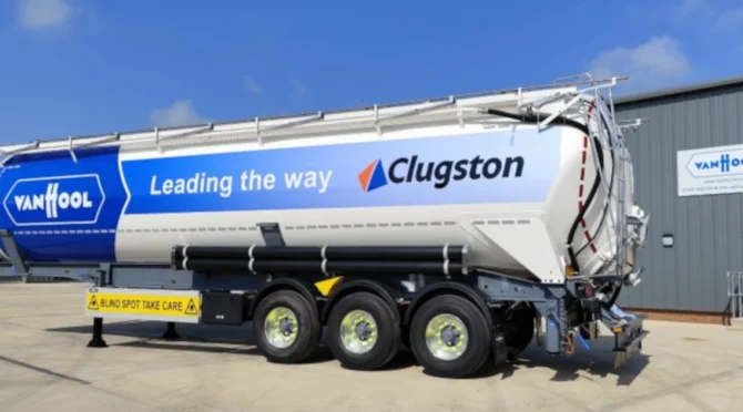 Clugston-branded VanHool 60m³ tipping silo tanker trailer with advanced Friction Stir Welding technology featuring blue and white livery and 'Leading the way' slogan