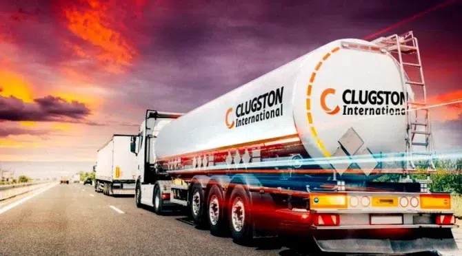 Clugston International branded tanker trailer on motorway at sunset